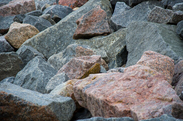 Mixed Granite Boulders and Riprap Texture Rough Pile of Red and Gray Rocks