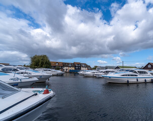 Holiday cruisers and rental boats in the boat yard in Wroxham, Norfolk Broads