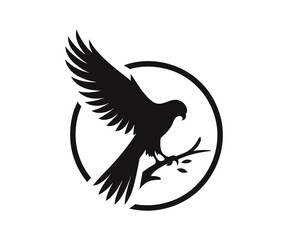 Silhouette of an eagle perched on a branch in circle