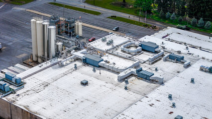 Aerial top down old industrial rooftop covered in compressed gas pipes Appalachia Pennsylvania