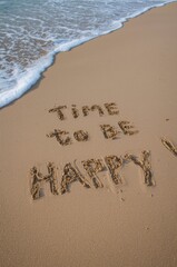 The gentle tide washes onto a pristine sandy shore, leaving behind a message etched in the grains: "TIME TO BE HAPPY". This evocative scene captures a sense of serenity and optimism, perfect for theme