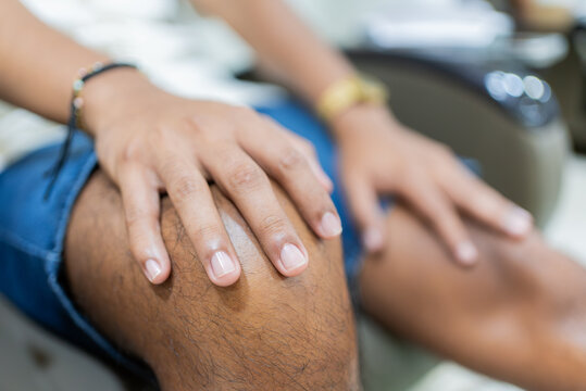 Close-up of a man's hands after receiving a manicure while getting a pedicure - Powered by Adobe