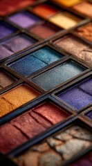 Fototapeta premium A closeup of a colorful eye shadow palette showcasing an array of rich hues perfect for creative makeup looks
