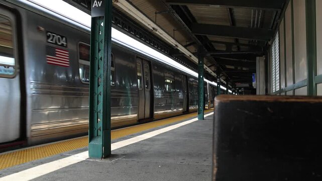 overhead above ground subway train passing train station in bensenhurst brooklyn new york city (nyc metro rail commuter line system) travel commute elevated tracks pass moving move cars car transport