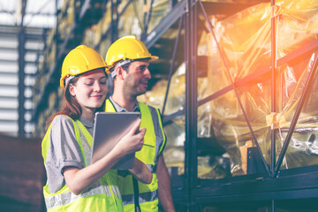 Engineers team or workers use tablet working in metal car part warehouse, import export, logistic business concept. Engineer checking spare part, transportation, distribution, industry factory