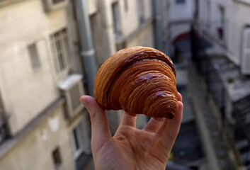 croissant with man hand