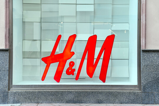 Seville, Spain; October 15, 2025: H&M fashion retail store logo sign on window display.