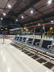 Empty Waiting Seats and Station Hall Interior