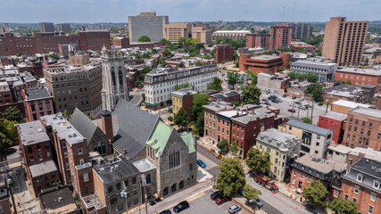 Morning sun shines on church and building architecture in the heart of the historic Mount Vernon...