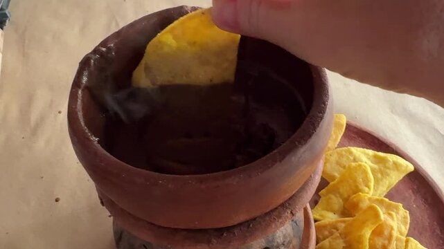 Guatemalan Black Beans in a Clay Pot over Fire with Chips (frijoles de olla)