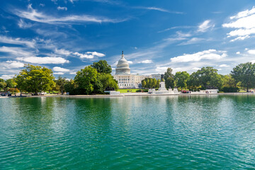 United States Capitol dome reflecting in pool on a clear summer day in Washington DC