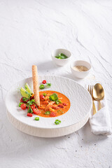 Refined Thai soup decorated with peppers, sesame and coriander.