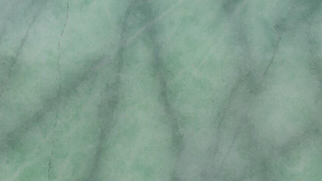 Soft green marble with subtle darker green veining and a slightly frosted or matte surface finish texture