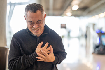 Senior asian adult elderly man with chest pain suffering from heart attack, health and medical,...