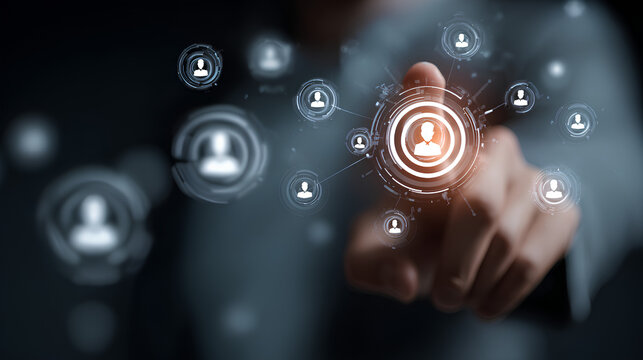 Target Audience and Digital Outreach Strategy Concept. Businessperson points at virtual interface with people icons and marketing symbols, representing audience targeting and global digital strategy.