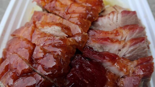 chinese food takeout lunch container with roast duck and glazed pork meat over white rice with cabbage (asian meal plastic) delicious bbq barbecue sweet sour combo platter cut sliced 