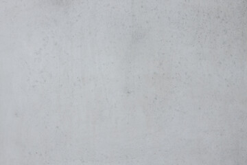 Smooth gray concrete texture background with subtle variations and imperfections, ideal for design projects, presentations, and artistic applications showcasing industrial aesthetics