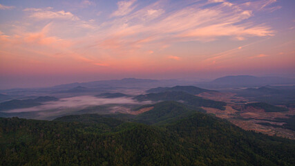 Fototapeta premium Aerial view scenery sweet sunrise at Samet Nang Chee viewpoint in Phang Nga. Beautiful sunrise tropical landscape background.The flare light from the sun shines down on the islands.sweet sky