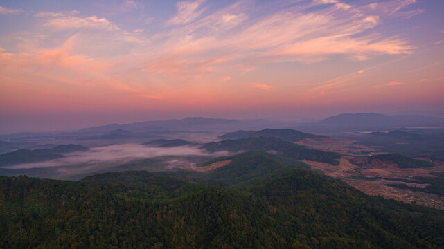 Aerial view scenery sweet sunrise at Samet Nang Chee viewpoint in Phang Nga. Beautiful sunrise tropical landscape background.The flare light from the sun shines down on the islands.sweet sky