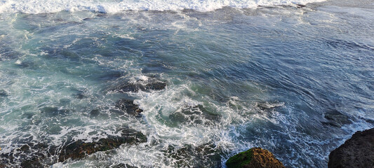Waves crashing down on the beach	