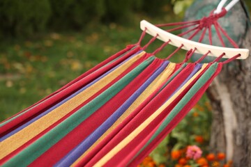 One comfortable colorful hammock in garden, closeup