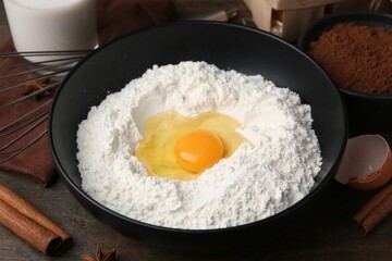 Ingredients for dough on wooden table, closeup