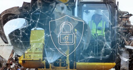 Material handler operator maneuvering grapple claw inside scrapyard cab, with vest, copy space
