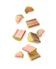 Fresh rhubarb pieces falling on white background