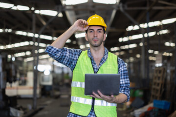 Factory male worker. Engineer man worker working with labtop checking working in industrial manufacturing factory, men at work to checking equipment of machinery production technology or construction.