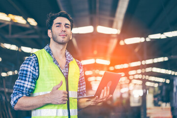 Factory male worker. Engineer man worker working with labtop checking working in industrial manufacturing factory, men at work to checking equipment of machinery production technology or construction.