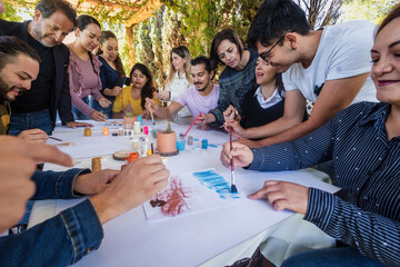 group of latin people in painting classes in a terrace outdoors in Mexico Latin America, multi...