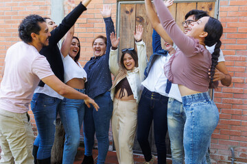 portrait of latin and multigenerational group of people or family together in a terrace outdoors in...