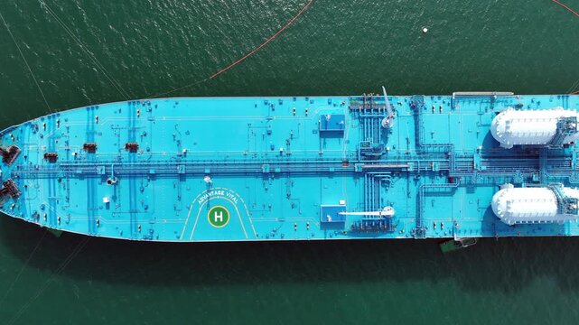 Aerial view oil ship tanker vessel loading and unloading in oil terminal station refinery, Global business import export logistic transport sea freight cargo tanker, Blue crude oil tanker ship at port