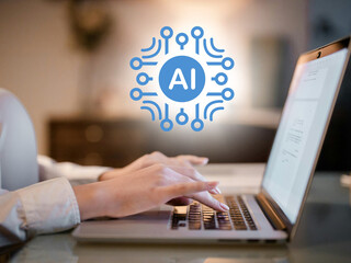 Person typing on laptop with glowing ai circuit graphic