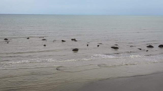 view of the waves at Pagatan Beach when the tide is low
