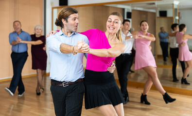 Fototapeta premium young girl with guy dances inspiring and energetic jive dance