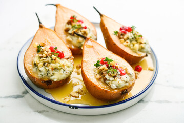 Delicious baked pears with nuts, blue cheese, thyme, cranberry and honey