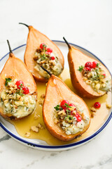 Delicious baked pears with nuts, blue cheese, thyme, cranberry and honey