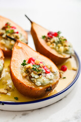 Delicious baked pears with nuts, blue cheese, thyme, cranberry and honey