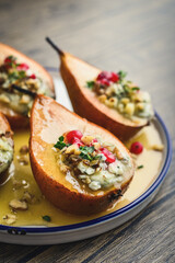 Delicious baked pears with nuts, blue cheese, thyme, cranberry and honey