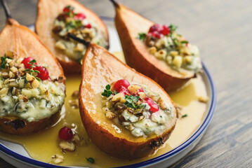 Delicious baked pears with nuts, blue cheese, thyme, cranberry and honey