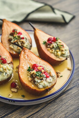 Delicious baked pears with nuts, blue cheese, thyme, cranberry and honey