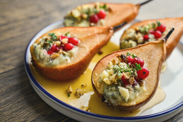 Delicious baked pears with nuts, blue cheese, thyme, cranberry and honey