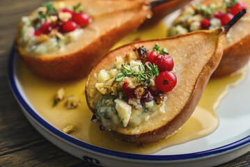 Delicious baked pears with nuts, blue cheese, thyme, cranberry and honey