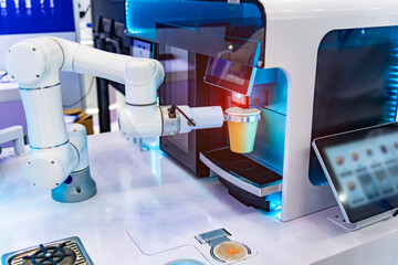 automatic robot arm preparing coffee with coffee machine