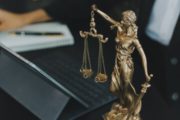 Judge gavel with Justice lawyers having team meeting at law firm background. Concepts of Law and Legal services.