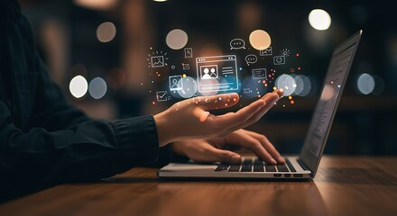 Person Using Laptop with Digital Icons and Graphs Floating Above Keyboard in Dark Room