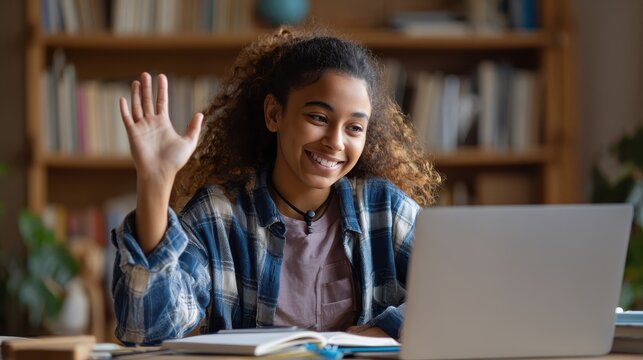 hispanic teen girl school college student distance learning waving hand studying with online teacher on laptop screen elearning zoom video call videoconference class with tutor over shoulder view no 
