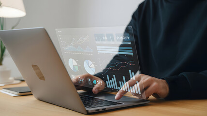 Business data analysis on laptop using technology charts graphs and diagrams for financial planning report