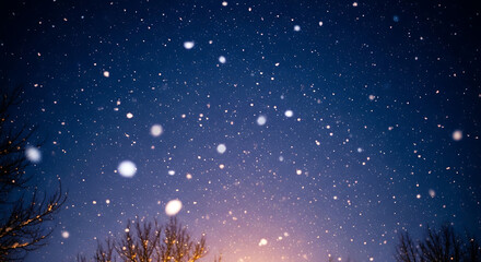 Snow falling from dark night sky. Winter weather background with snowfall and stars